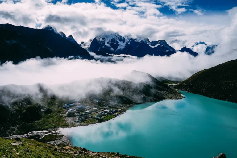 Calm mountain lake surrounded by green hills