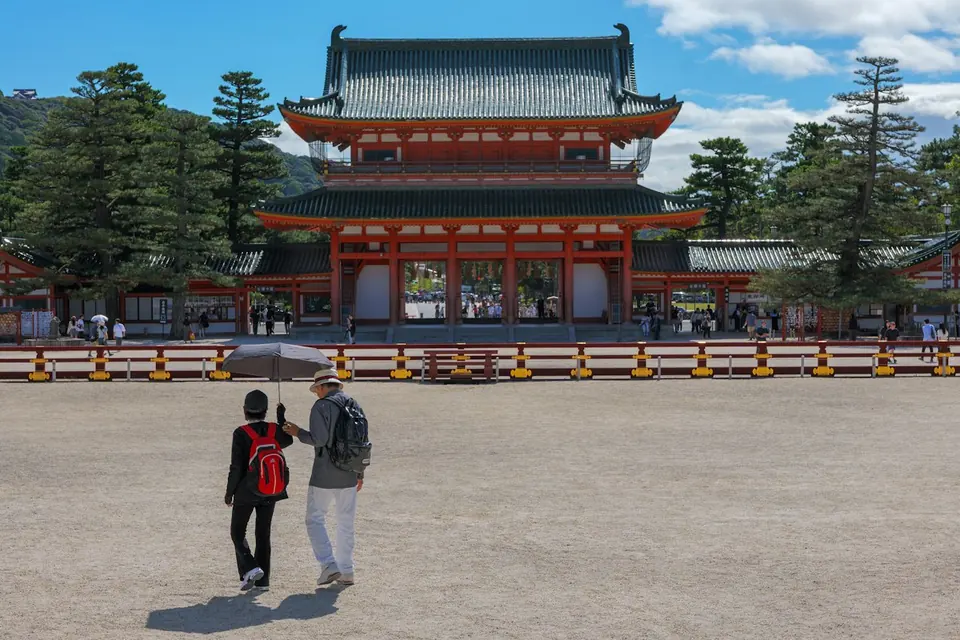 Visitors approaching a traditional temple in Kyoto, Japan